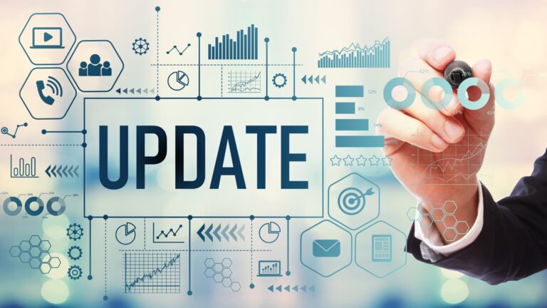 A hand drawing charts, graphs, and icons representing updated study materials and data, reflecting the importance of using current resources for exams like IAPP certifications.