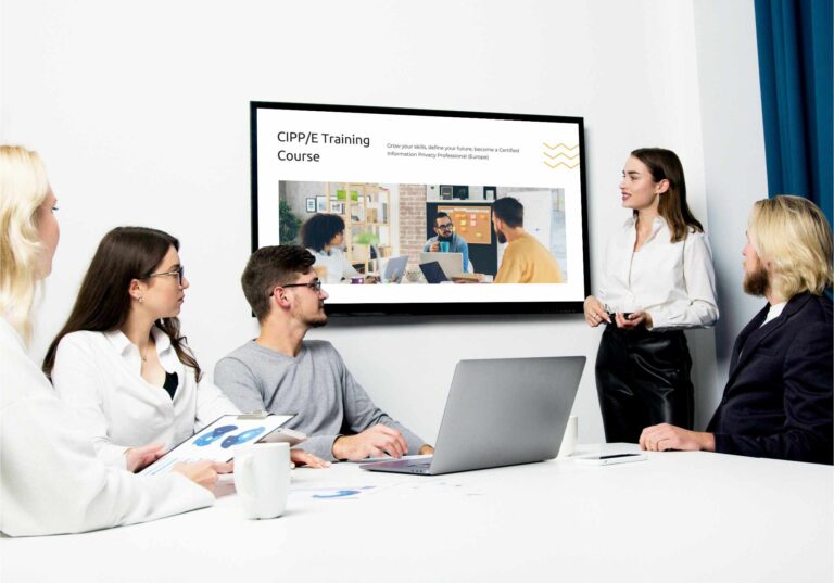 Students and teacher looking at screen