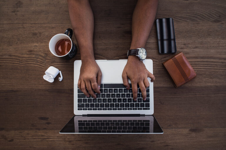 someone typing on a laptop