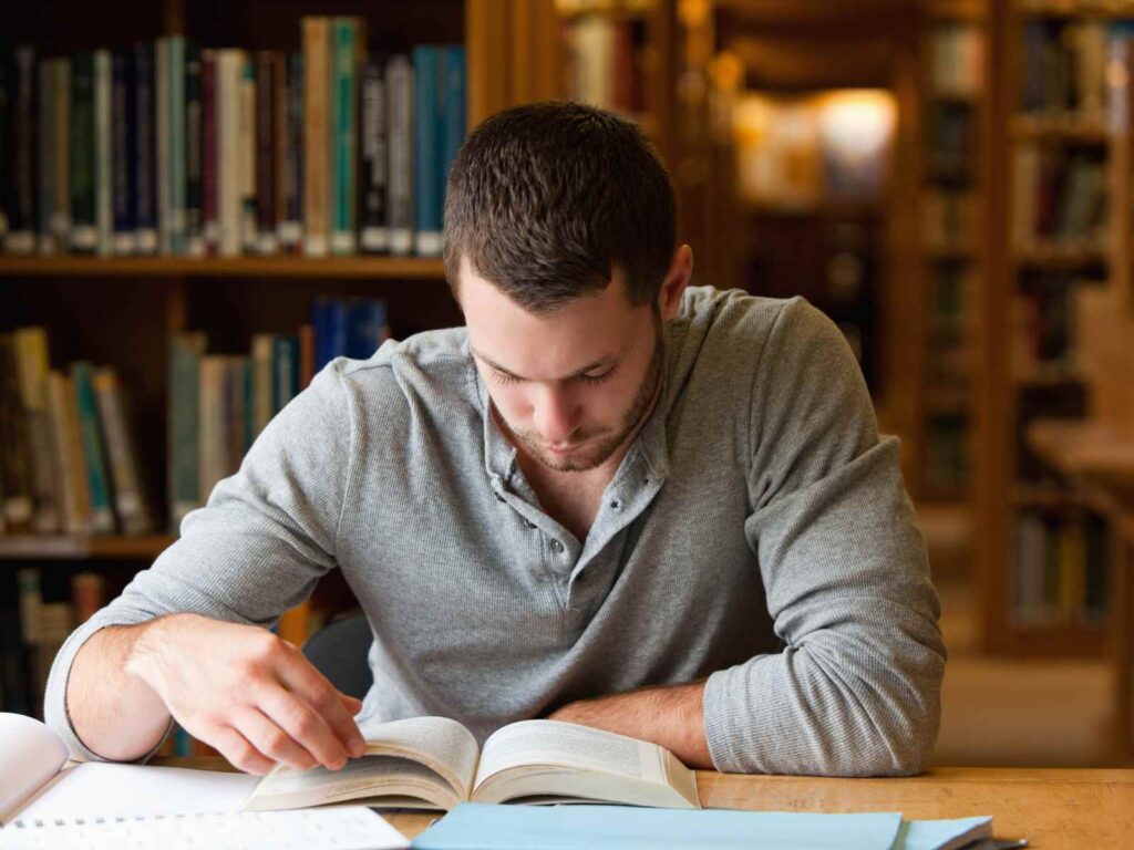 man reading privacy book in a library